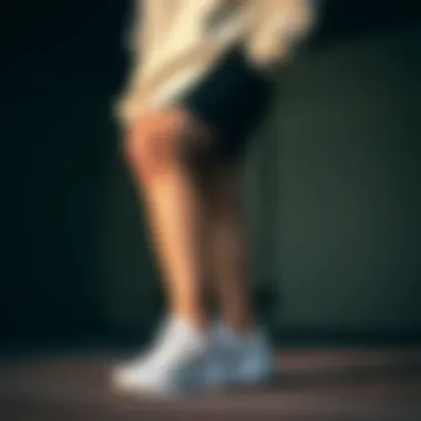 Versatile Athletic Outfit with Asics White Sneakers Athletic outfit paired with Asics white sneakers demonstrating versatility.