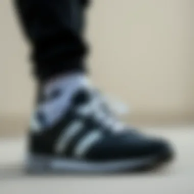 Stylish outfit combination featuring Hummel black and white sneakers