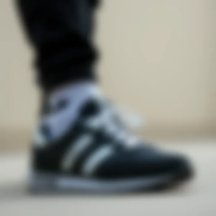 Stylish outfit combination featuring Hummel black and white sneakers