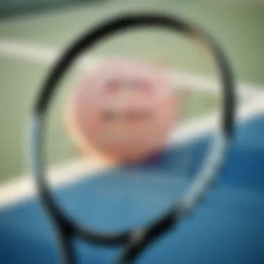 Close-up of a high-quality tennis racket with strings and grip